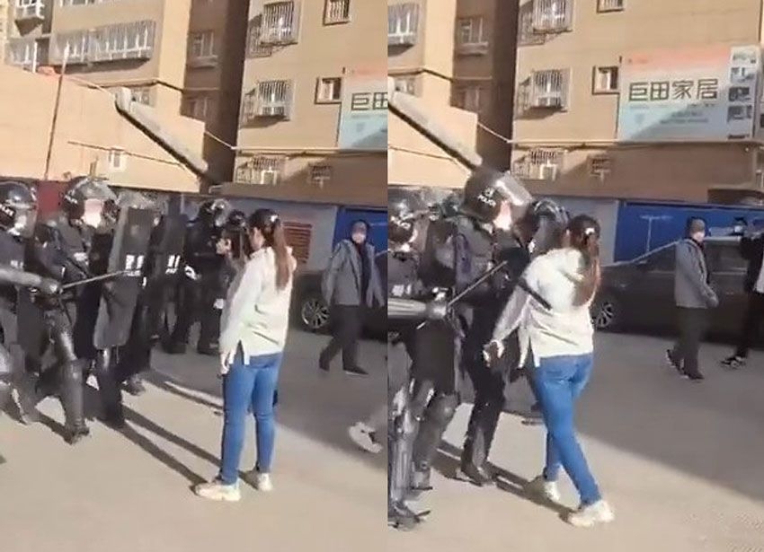 중국에서 진압하는 경찰에 맞서 시위를 벌이는 중국 여대생의 영상이 시위 확산에 불을 지피고 있다. /연합뉴스.